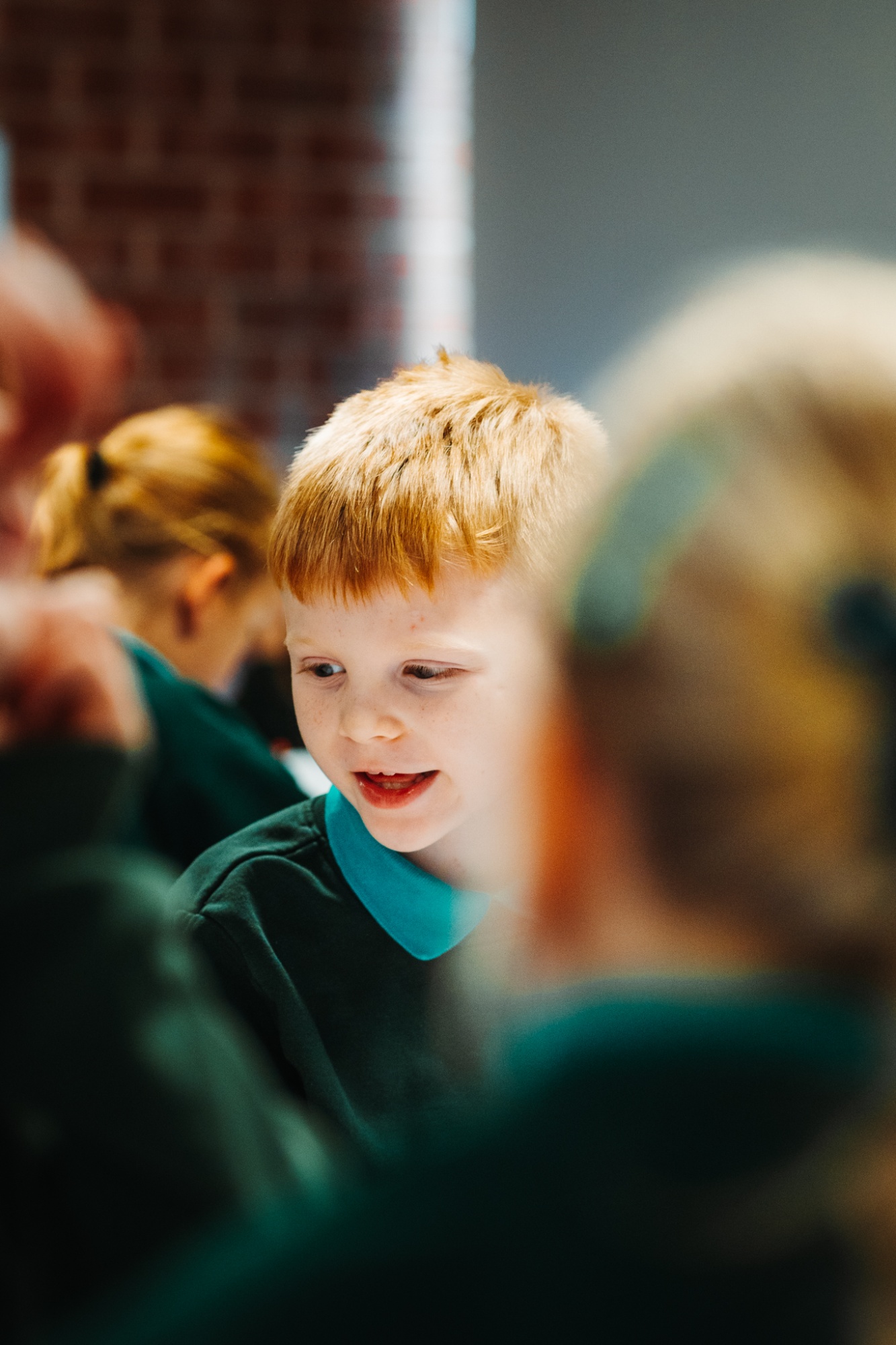 boy smiling in classroom