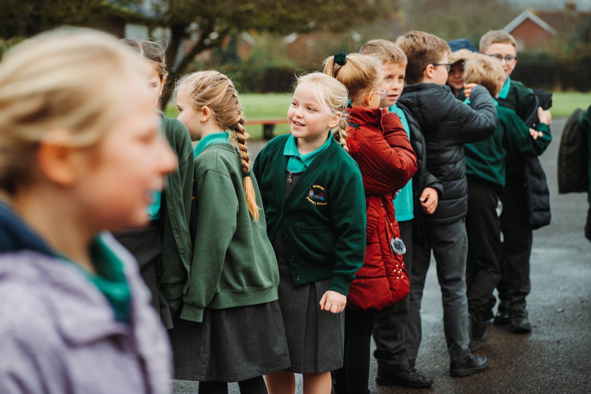 children waiting on playground after break time