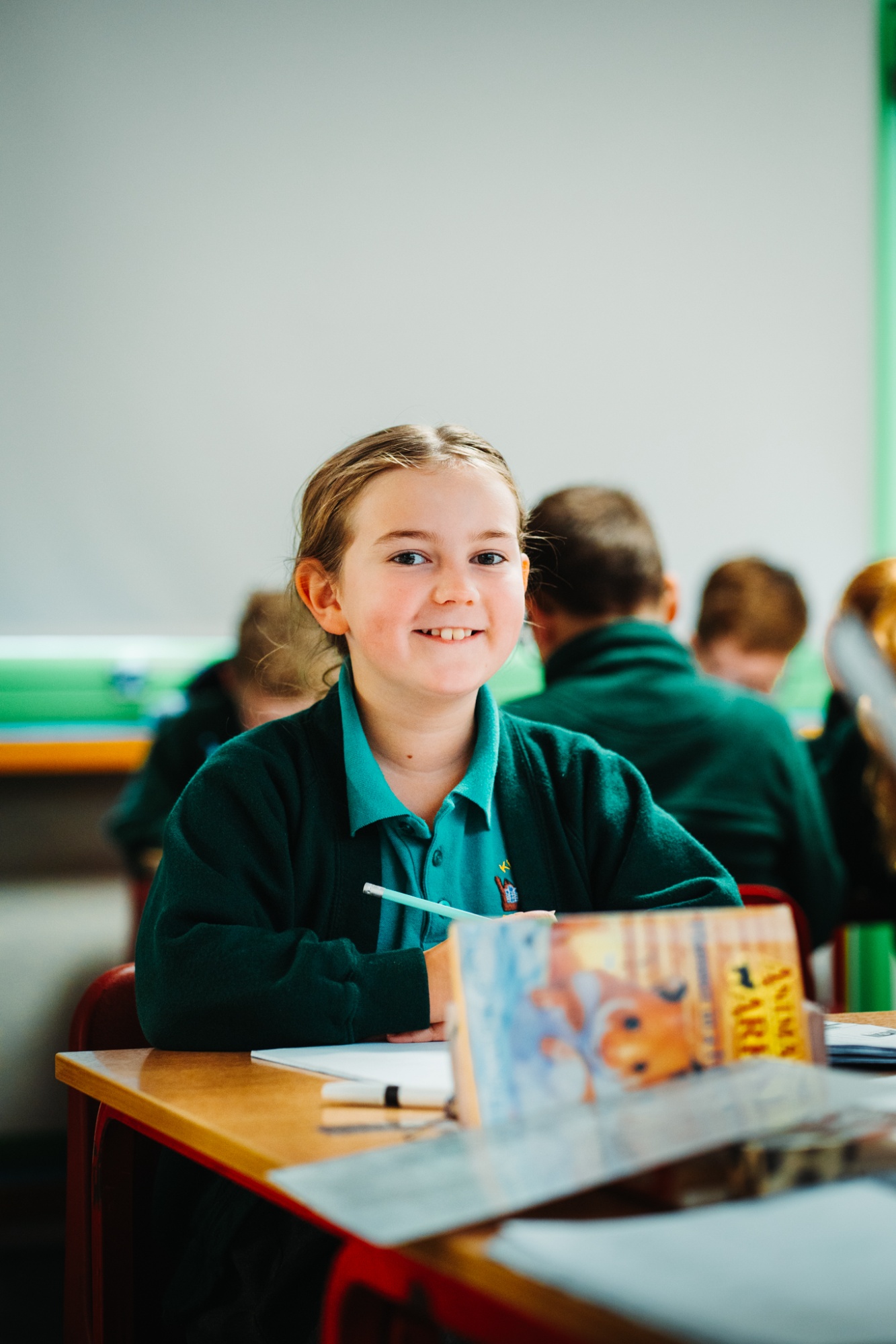 girl smiling in classroom
